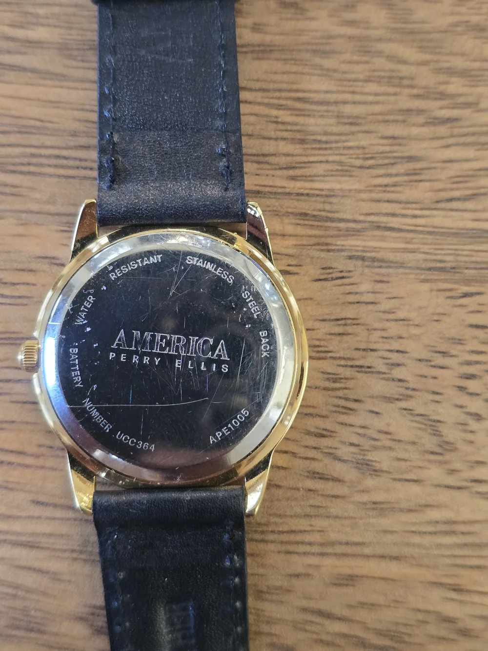 Perry Ellis Men’s Gold Case Black Leather Watch